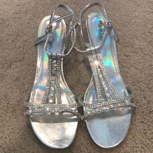 Silver jeweled heels.